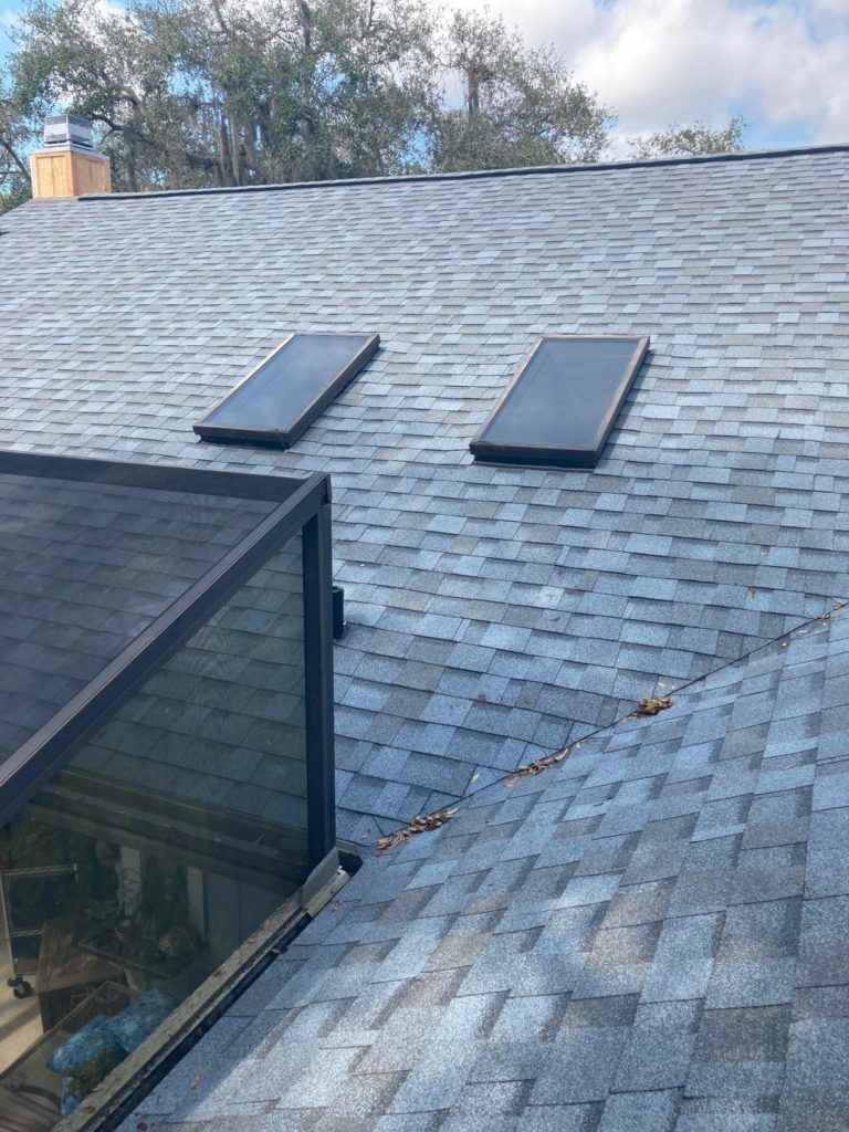 new skylights on a shingle replacement roof.