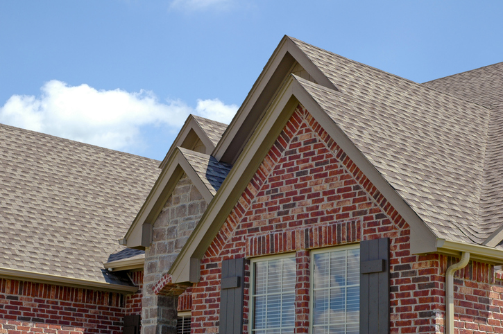 complex gabled roof system with new shingles