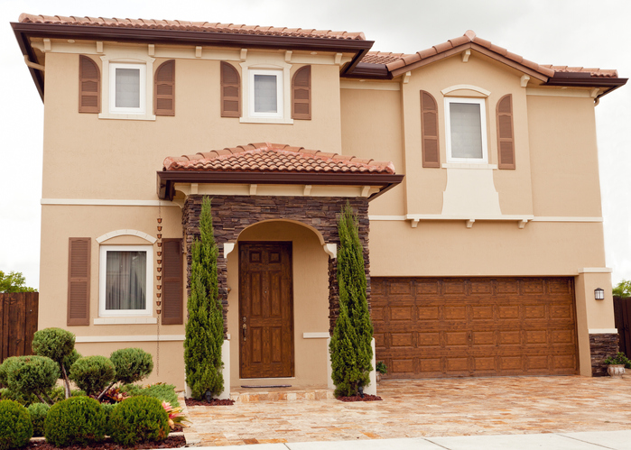 two story home with a tuck-under garage